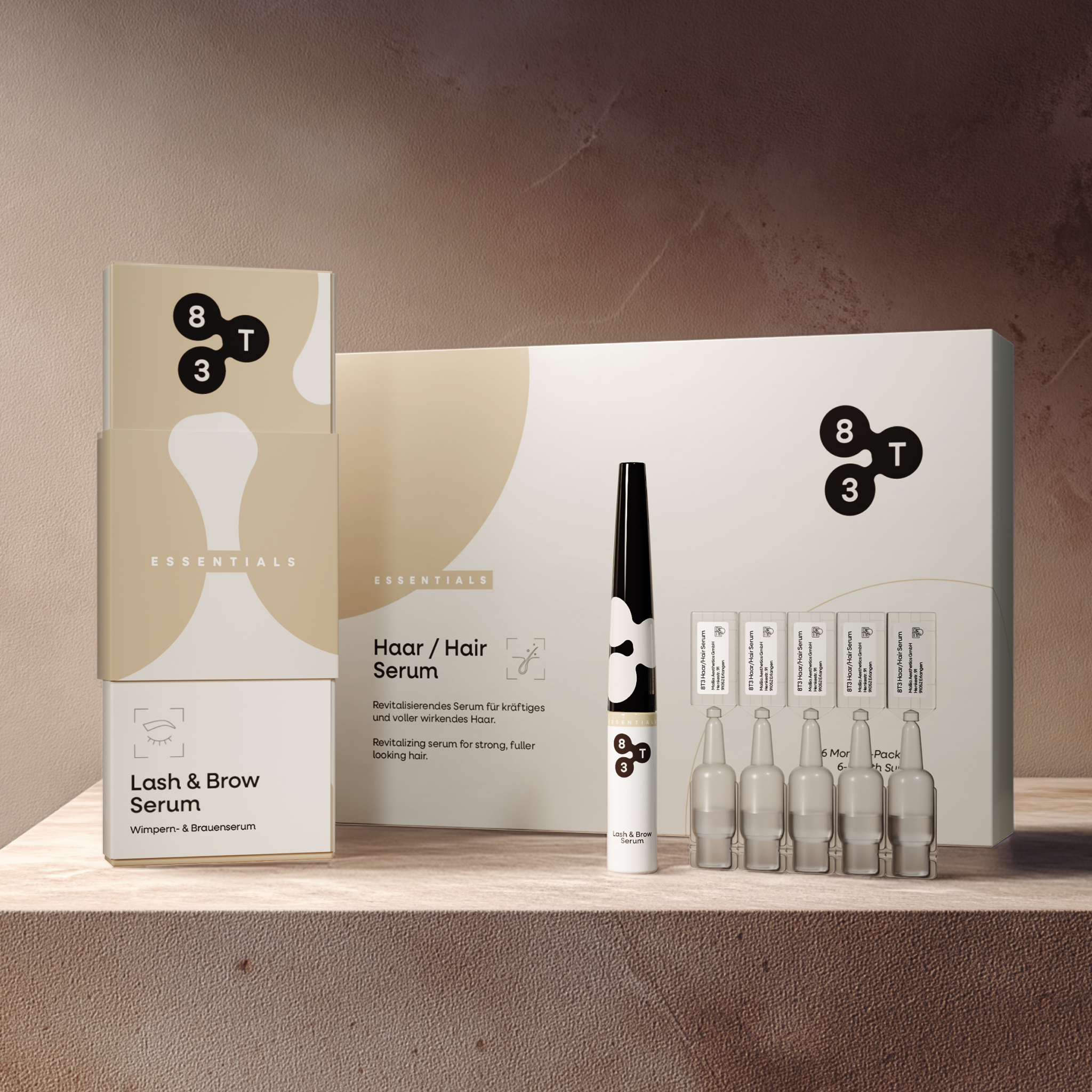 The 8T3 “Lash & Brow Serum” and “Hair Serum” with their outer packaging.