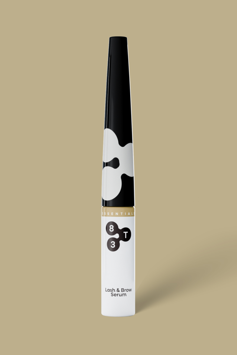8T3 Lash & Brow Serum – slim black and white tube against a beige background