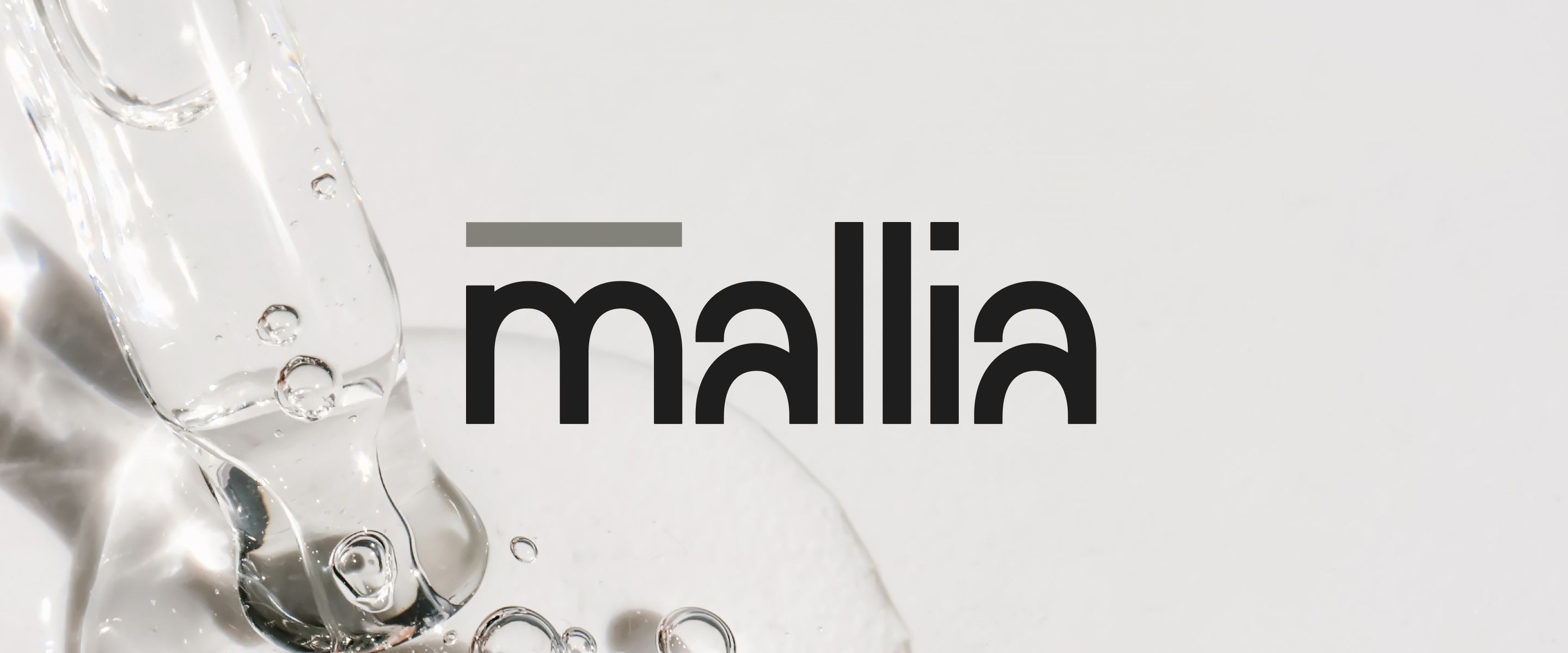 Mallia word mark on a light background with a flowing, clear gel texture and air bubbles